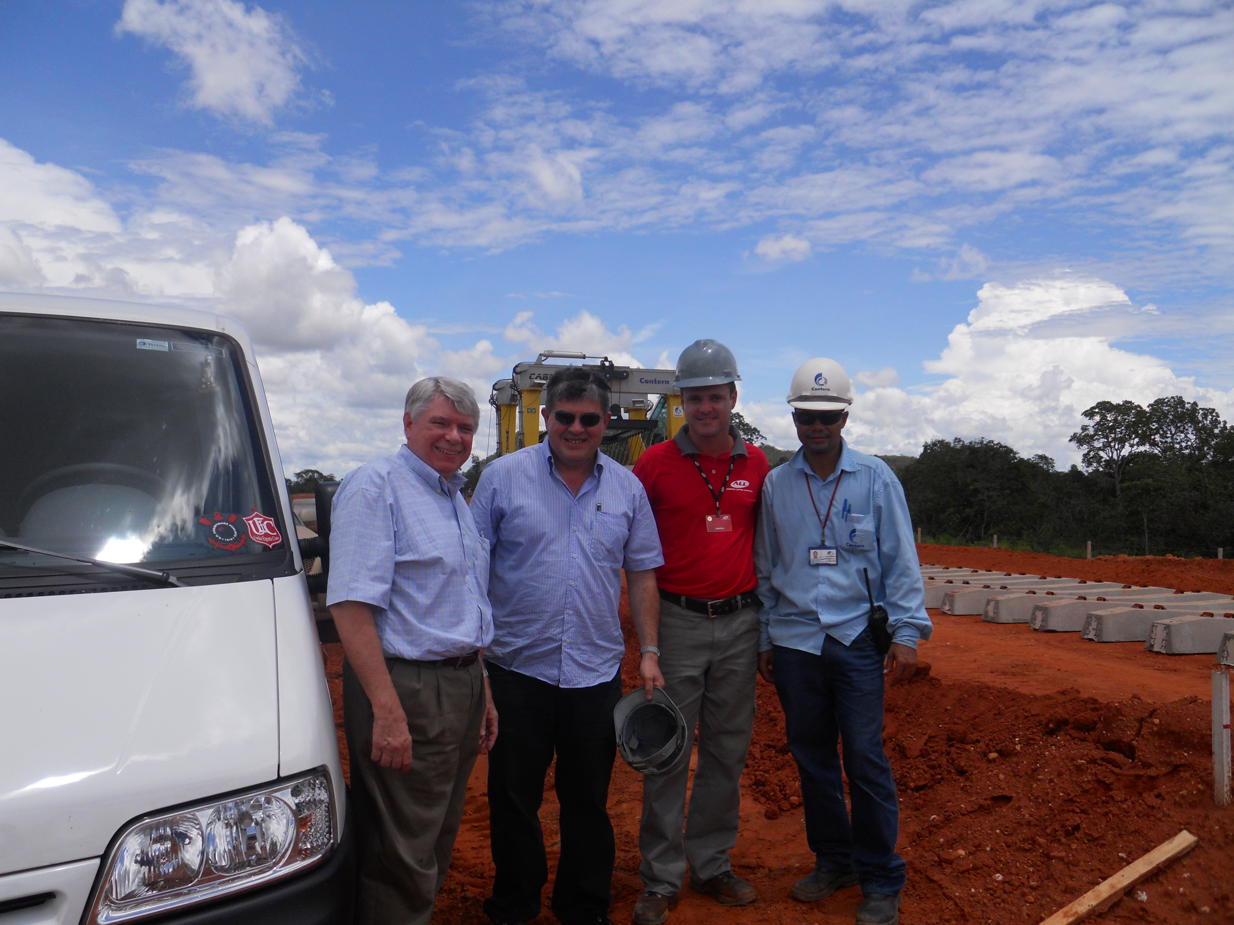 Left to right, Michael Cordonnier, Joubert Lansoni da Silva (chief consultant), Leandro Redivo (chief engineer), and construction foreman of Ferronorte Railroad near Alta Araguaia in southeastern Mato Grosso, Brazil