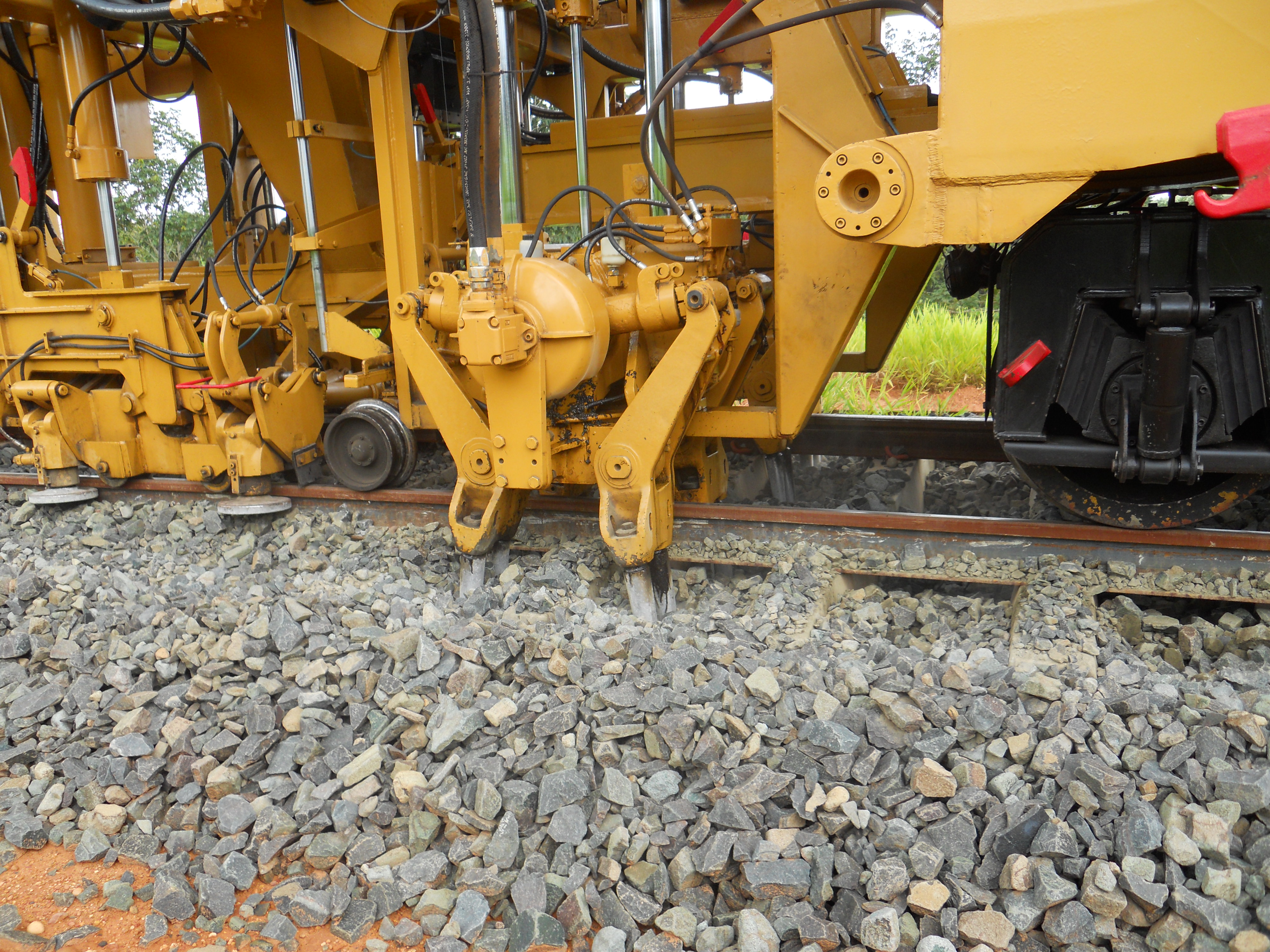 Aligning and leveling new track on Ferronorte Railroad near Alta Araguaia in southeastern Mato Grosso, Brazil