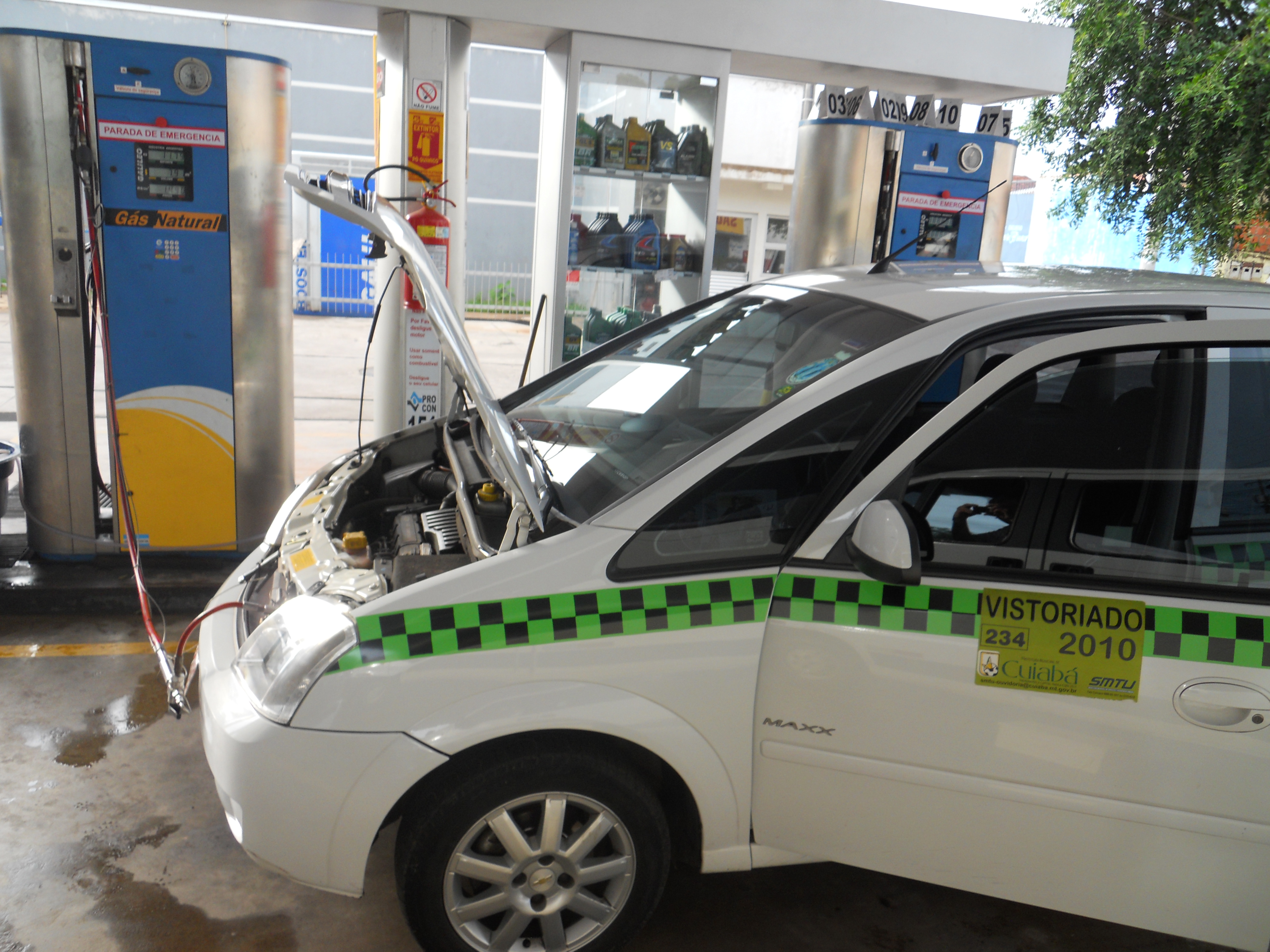 Filling taxi with natural gas in Cuiaba, Mato Grosso, Brazil