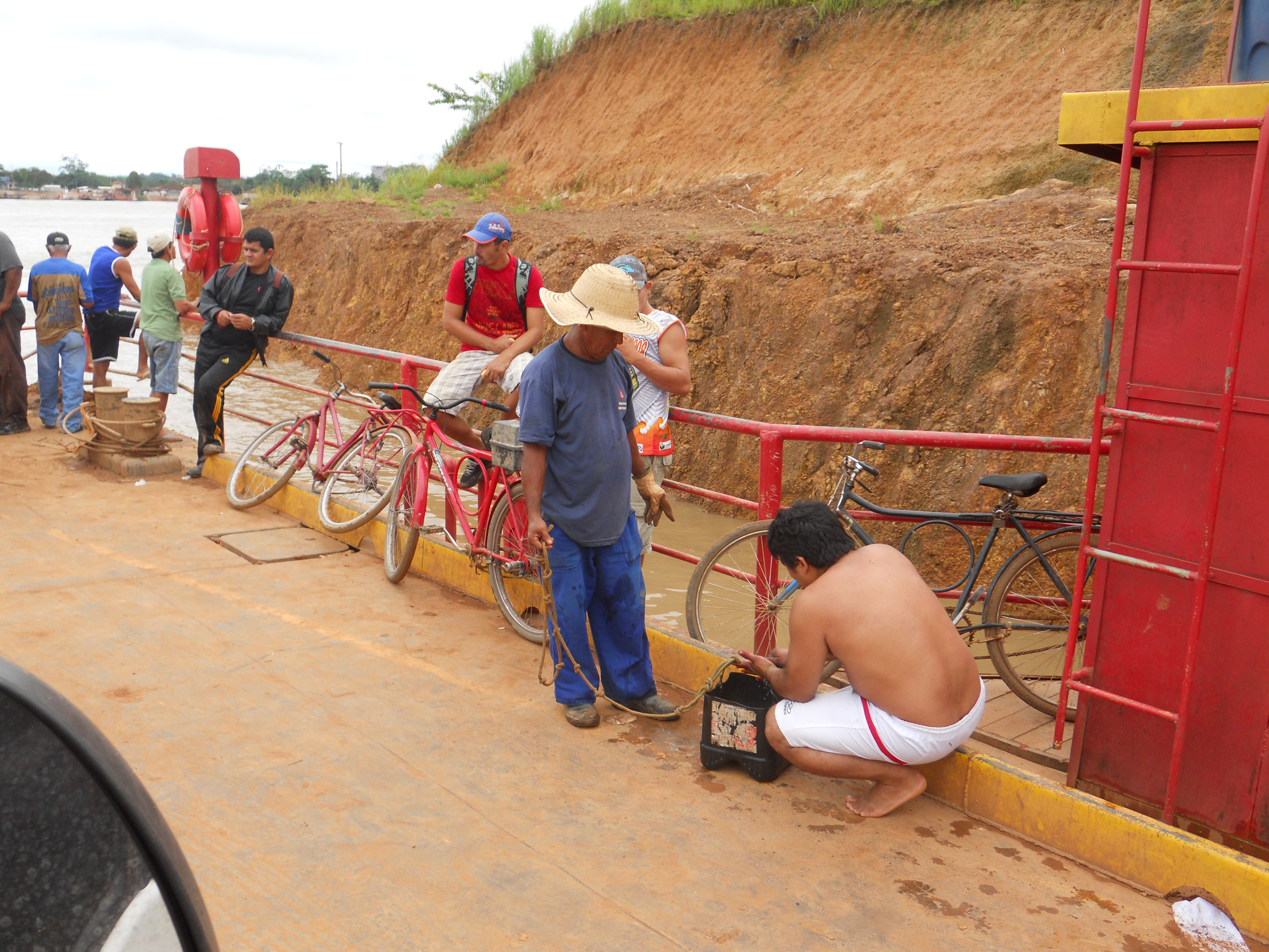 Cleaning up on the ferry boat crossing the Madeira River in northern Brazil