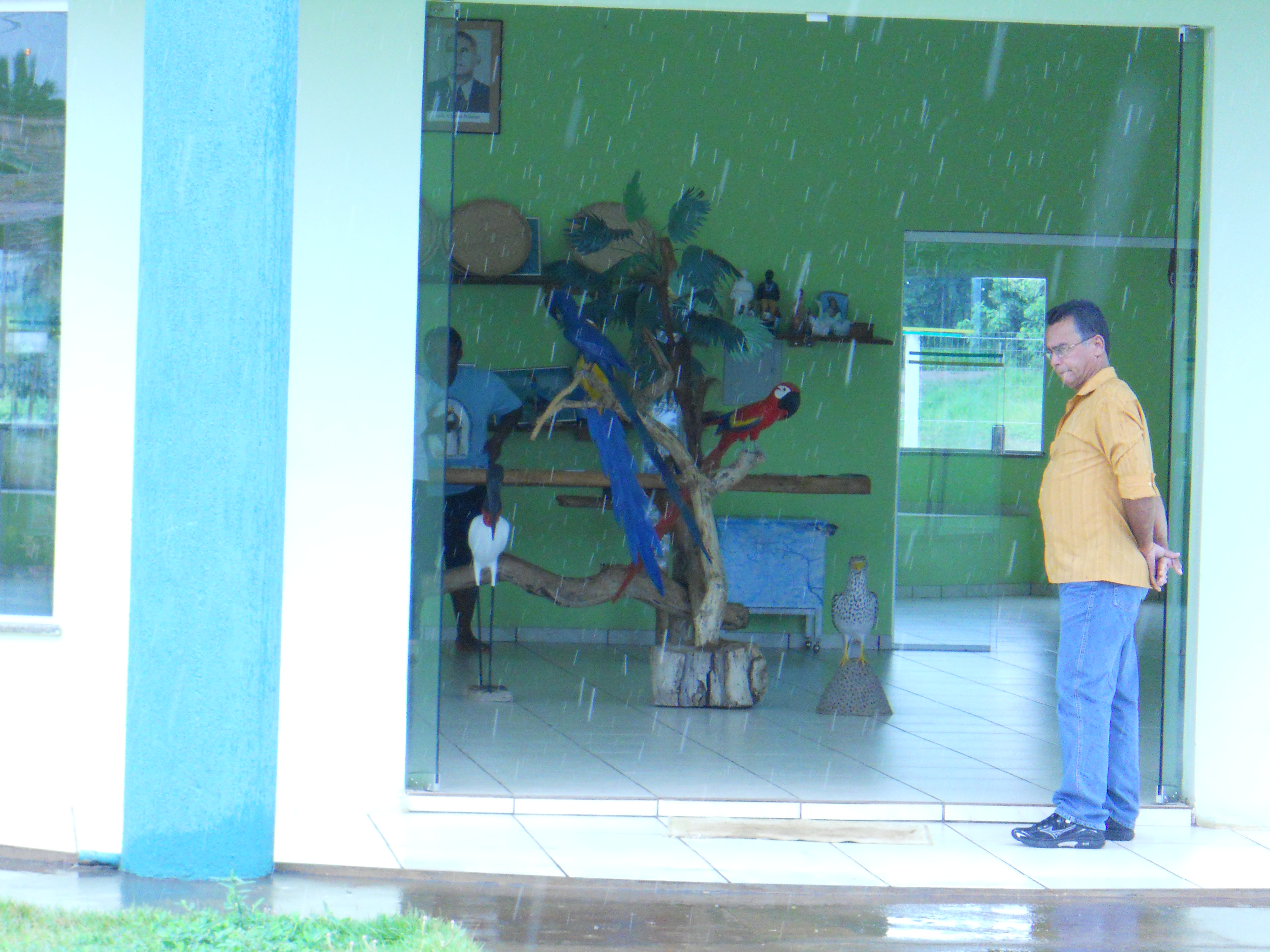 Waiting out the rain at tourist office in Pocone at entrance to Pantanal in southern Mato Grosso, Brazil